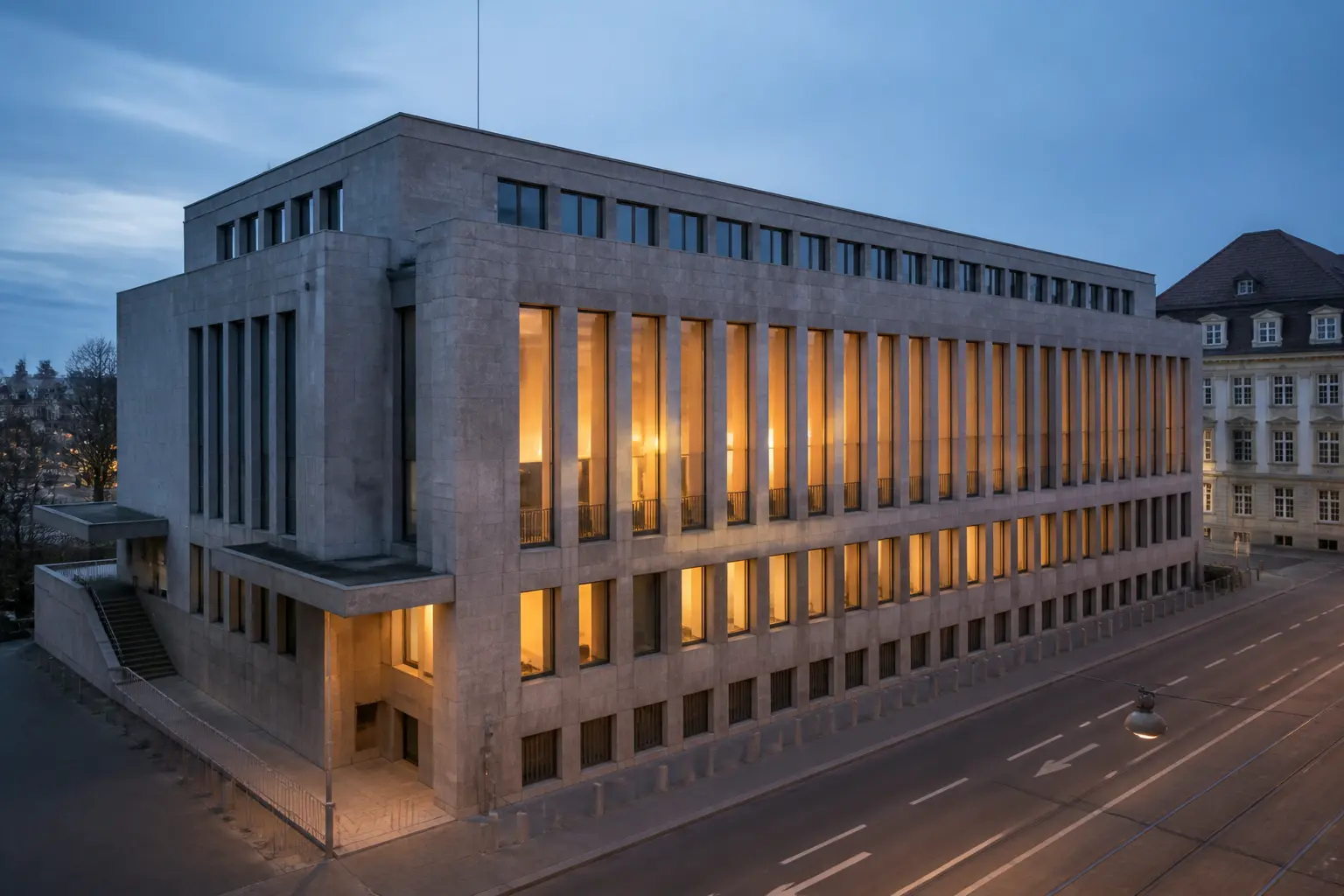 Будівля міжнародної фінансової організації в Базелі ввечері